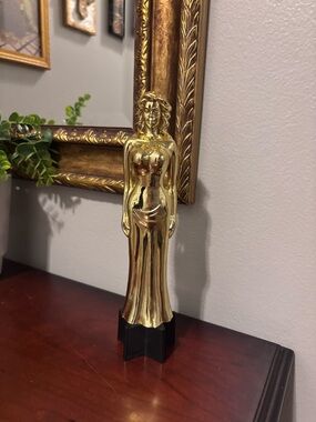 Winner, Winner…Gold Female Figure Sculpture on Black Base.